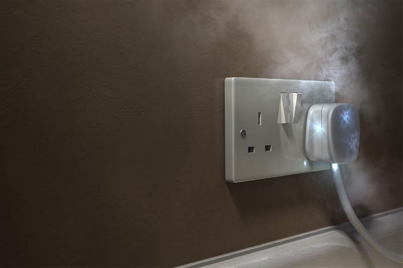 A plug that's overheated, with smoke pouring out.