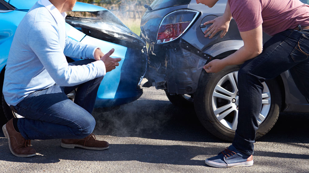 inspecting the damage after a road accident