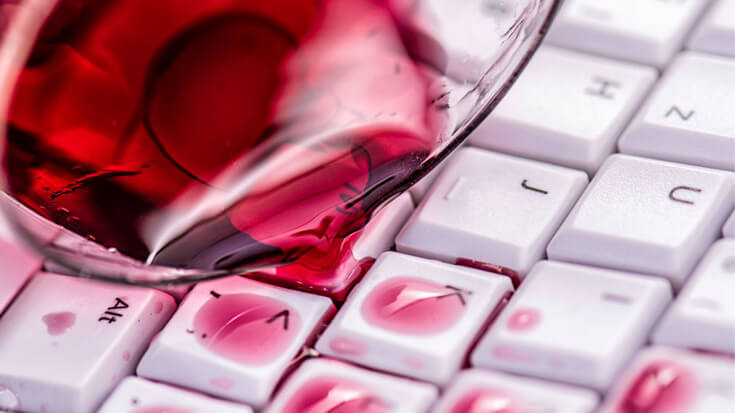 Red wine has spilled over a keyboard