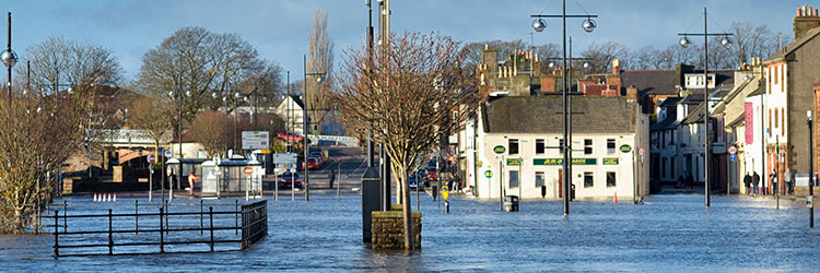 Flooded town centre with white houses