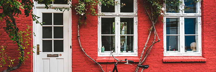 Red house with white windows and doors